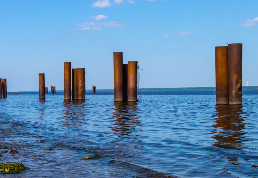 Interlocking sheet-pile bulkhead panels along a shallow bay lagoon